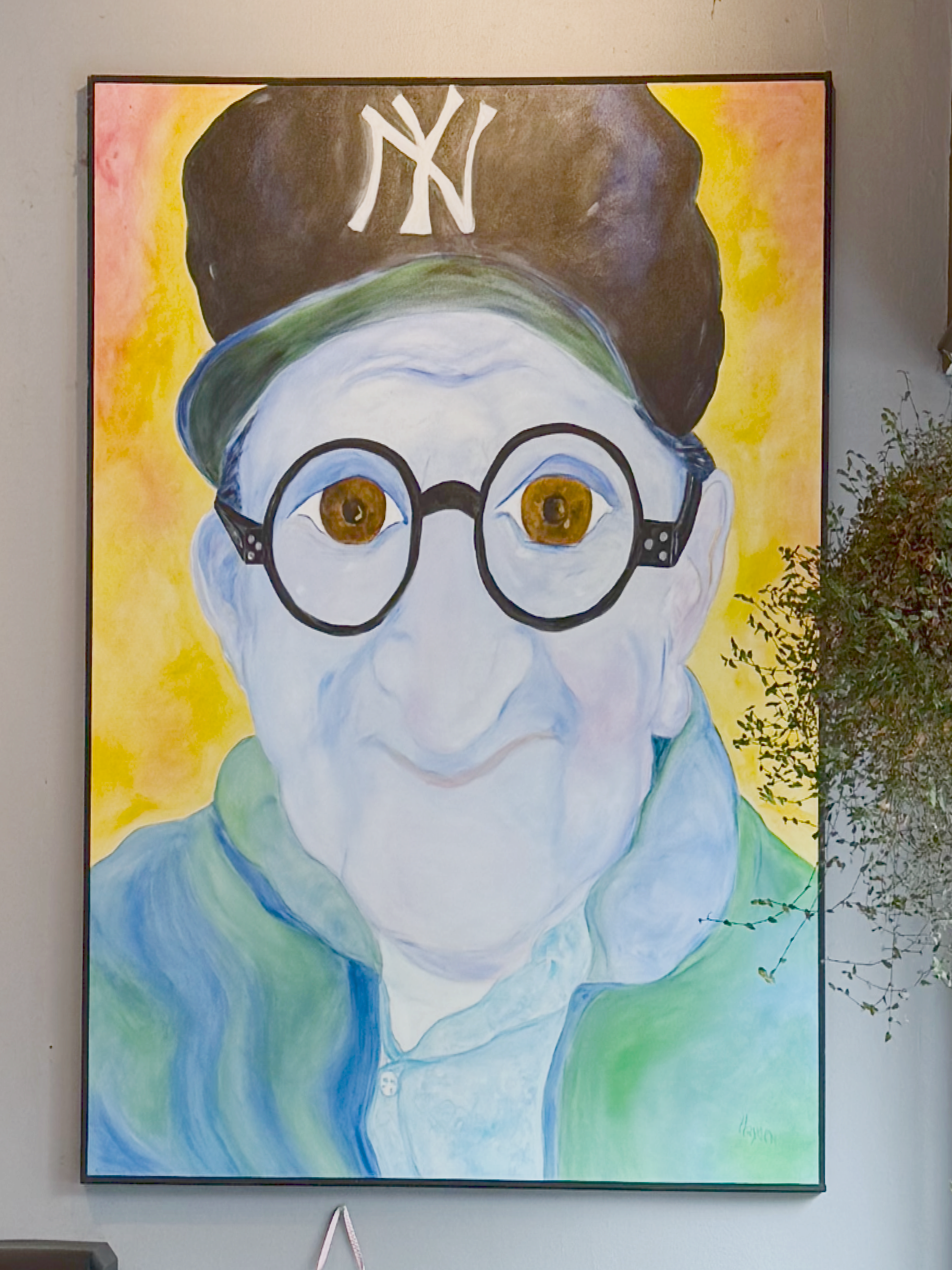 Photo of the painting "George" by Carla Hayden on display inside Brothers K Coffee.
