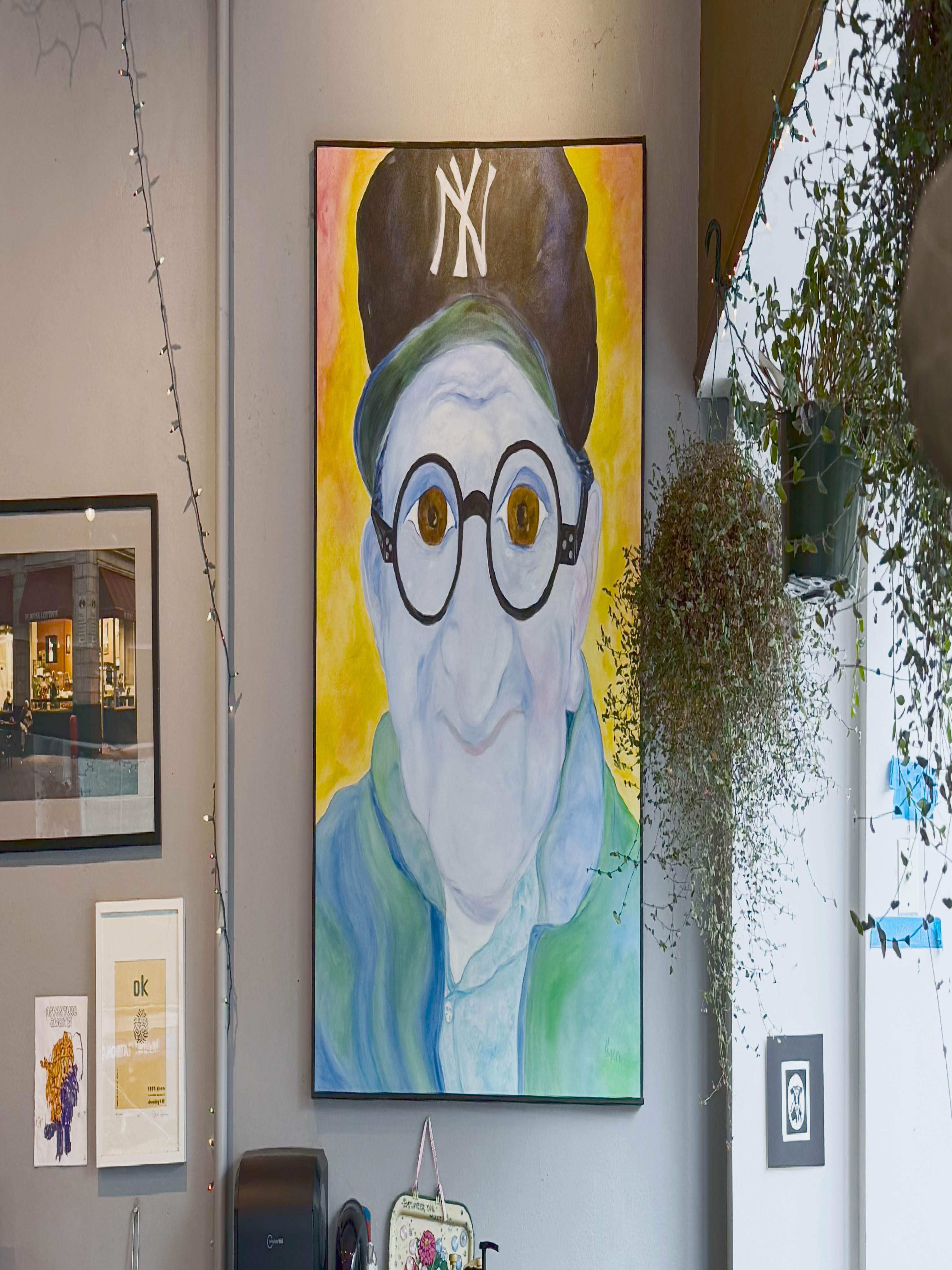 Photo of the painting "George" by Carla Hayden on display inside Brothers K Coffee.